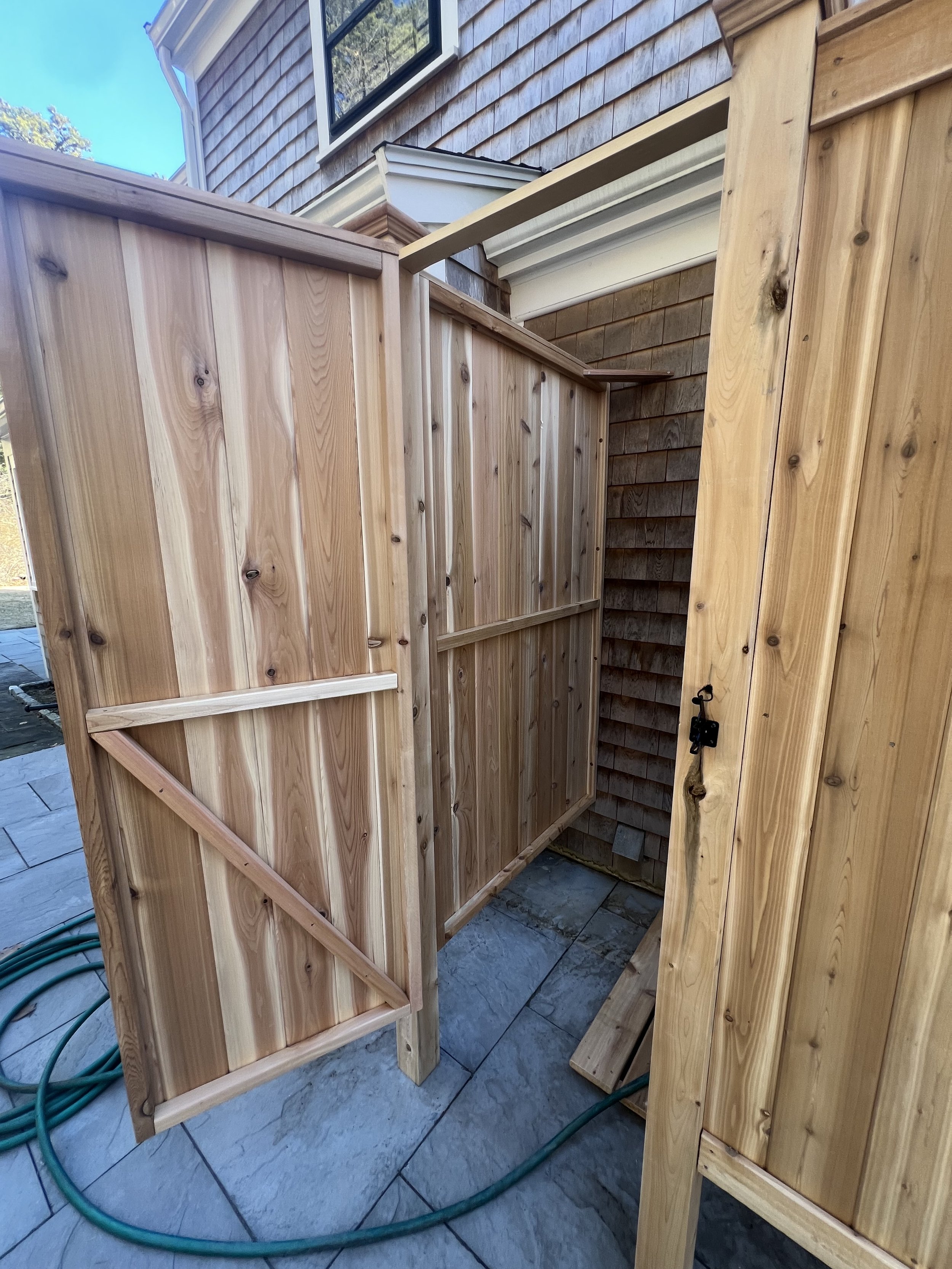Cedar outdoor shower enclosure and gate in progress.